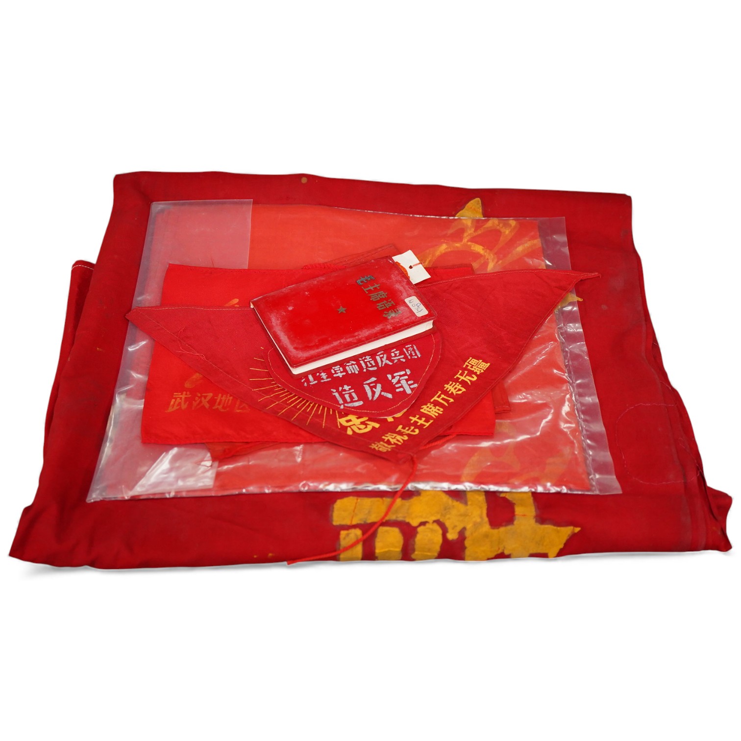 A Chinese Cultural Revolution flag, three armbands, a red book, a badge and a small flag-85cm wide x 102cm long